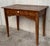 A charming early 20th century Spanish pine farm table with four tapered legs and a wonderfully well-worn finish from a...