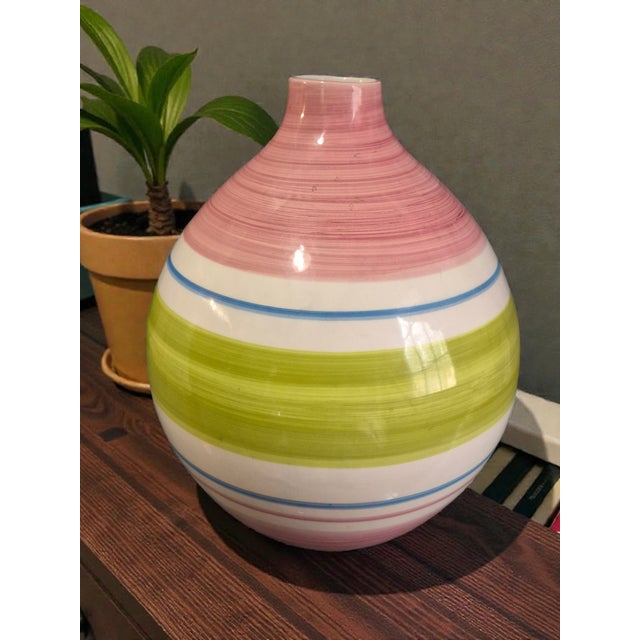 This vintage striped multi-color ceramic vase, made in Portugal, is a charming and decorative collectible piece for any...