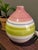 This vintage striped multi-color ceramic vase, made in Portugal, is a charming and decorative collectible piece for any...