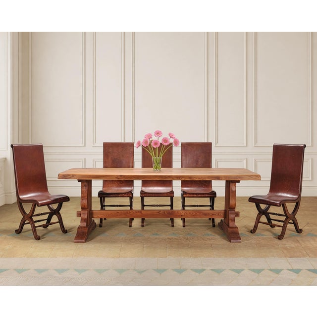 A substantial 20th century Country French Provincial farmhouse trestle dining table or monastery table measuring over 7...