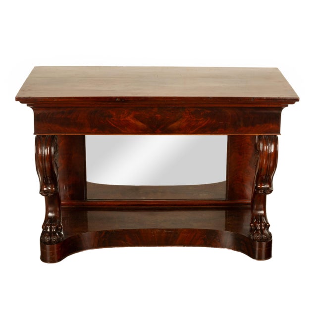 A fine antique English William IV Empire style flame mahogany mirror back pier, console table circa 1830. The table is...