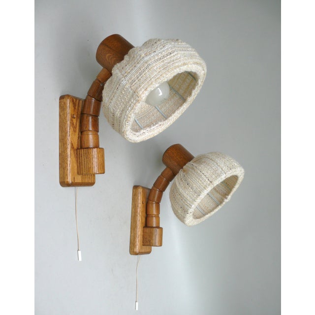 A pair of exceptional country-style wall lights from the 1960s, manufactured by Fischer-Leuchten in Germany. The beige...