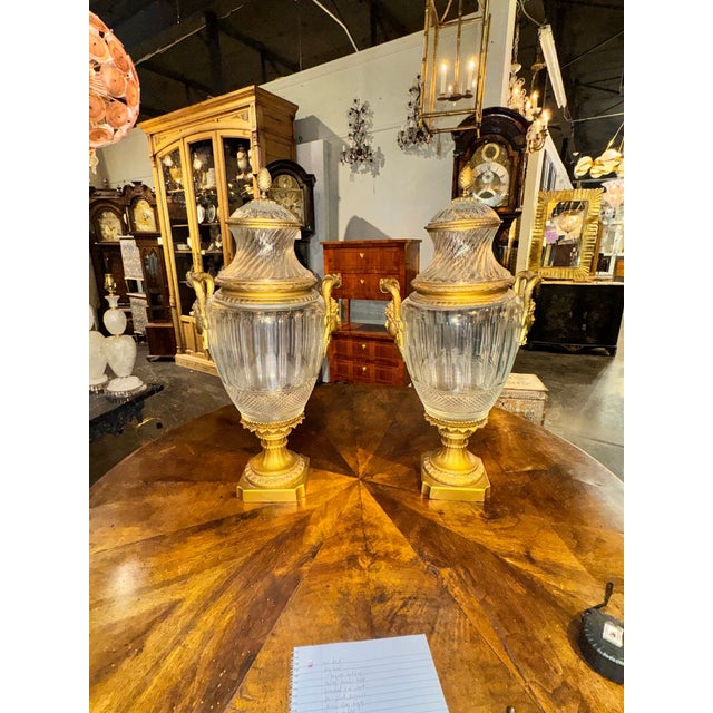 The product is a pair of 19th century signed Baccarat Palace urns. These decorative collectibles are likely to be elegant...