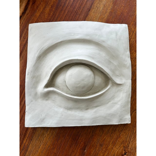 Fantastic Vintage Plaster Eye Sculpture Wall Plaque. Dating to the 1970’s. In a relief style, with undulating lines and...