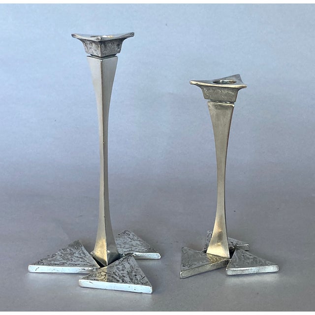 Hand-fabricated, most likely made of brass (they're non-ferrous but far too heavy to be aluminum), nickel-plated, probably...
