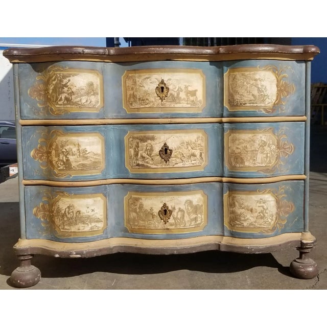Italian or German chest of three drawers in the baroque style c 1750. Retaining the original painted finish the ground...