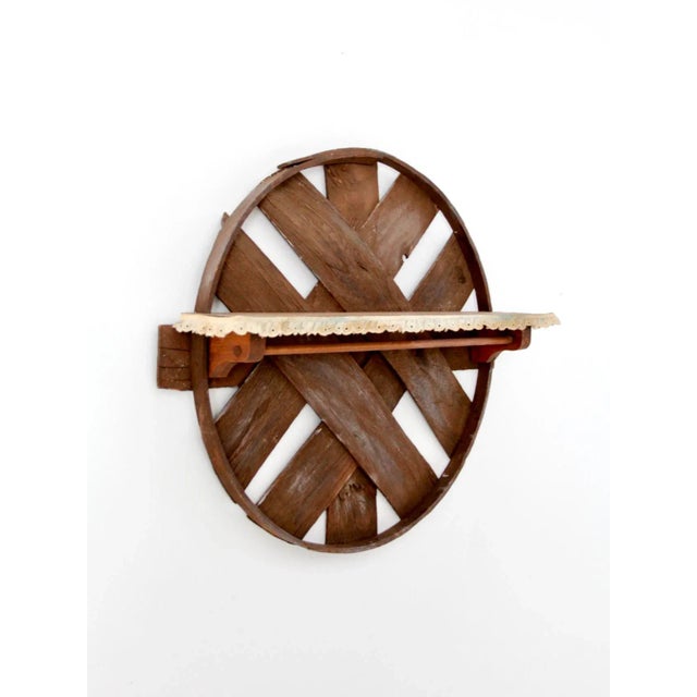 This is a rustic vintage hanging shelf with hanging rod. The farmhouse decor wall piece features a bentwood frame with...