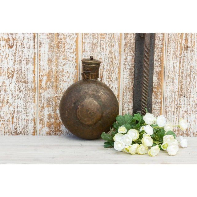 This rare find is a Mughal water bottle from India. This water vessel is made from soild brass and features a large round...