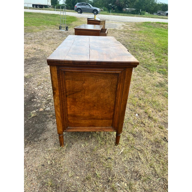 Elegant 18th-century Louis XVI commode, finely crafted in richly figured walnut with beautiful geometric inlay and...