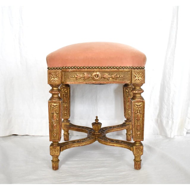 An antique Louis XIV period tabouret, stool, or bench, in carved gold gilt wood with straight baroque legs, flower,...