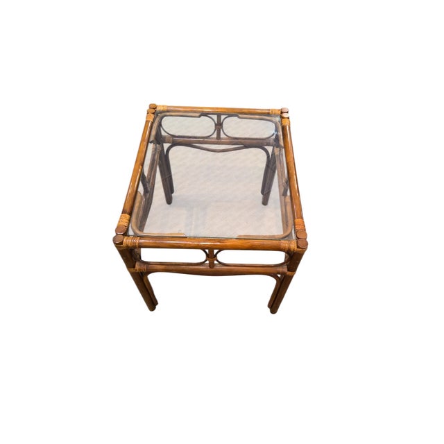 Mid Century modern bamboo rattan Palm Beach style 3 piece set. Set includes glass top coffee table measuring 16"H x 48"L x...