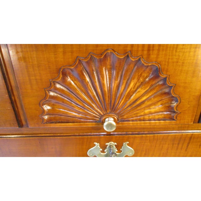 This is a chest of drawers made by Joseph Gerte of Boston. The chest is made of maple with curly maple drawers fronts. The...