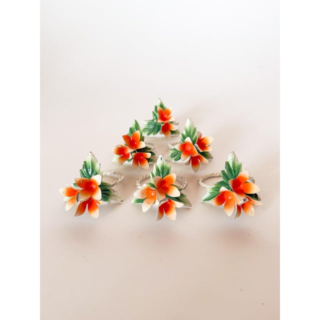 Charming set of 6 vintage Tole napkin rings with cheerful orange flowers and green foliage on a white twisted rope ring....