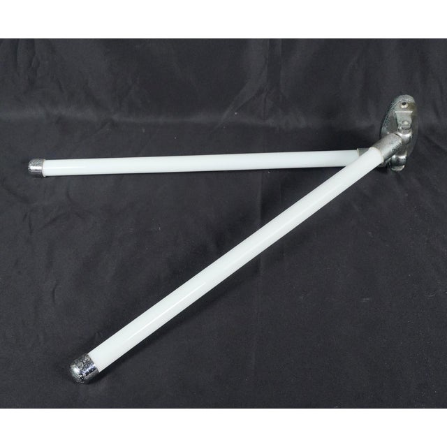 Mid Century style double arm wall mount towel rack. The bracket is made of nickel plated brass, and the rounded arms are...