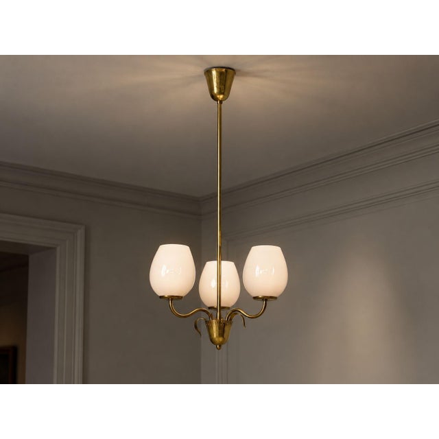 Idman Oy, Finnish Mid-Century Modern, Pendant Light or Chandelier, Brass, Pink Tinted Glass, Finland, 1950s A beautiful...