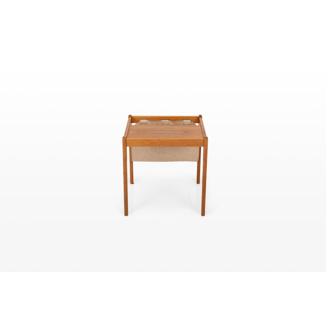 An elegant Danish teak sewing table by Brdr. Furbo, crafted in Denmark during the 1960s. Combining beautiful Mid-Century...