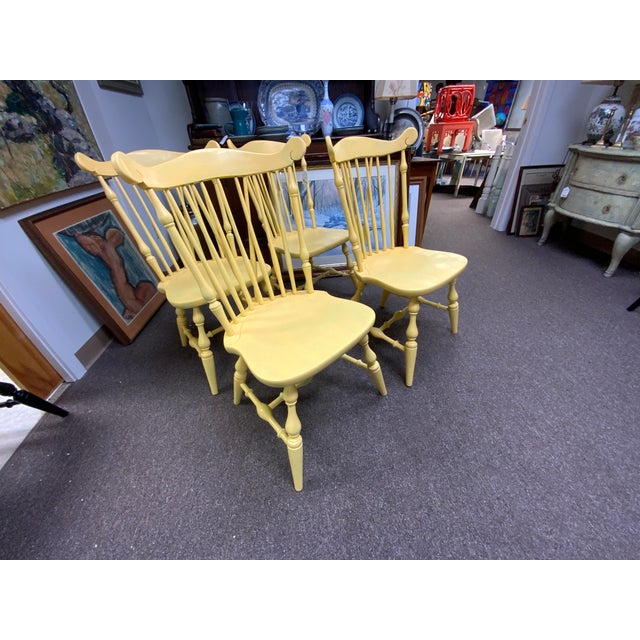 20th century painted yellow fan back Windsor chairs, set of four.
