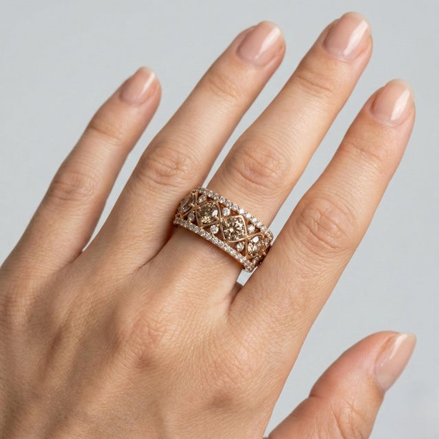 Elegant 14K yellow gold eternity-style band ring featuring a refined bezel-set diamond design. The band is set with 11...