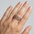 Elegant 14K yellow gold eternity-style band ring featuring a refined bezel-set diamond design. The band is set with 11...
