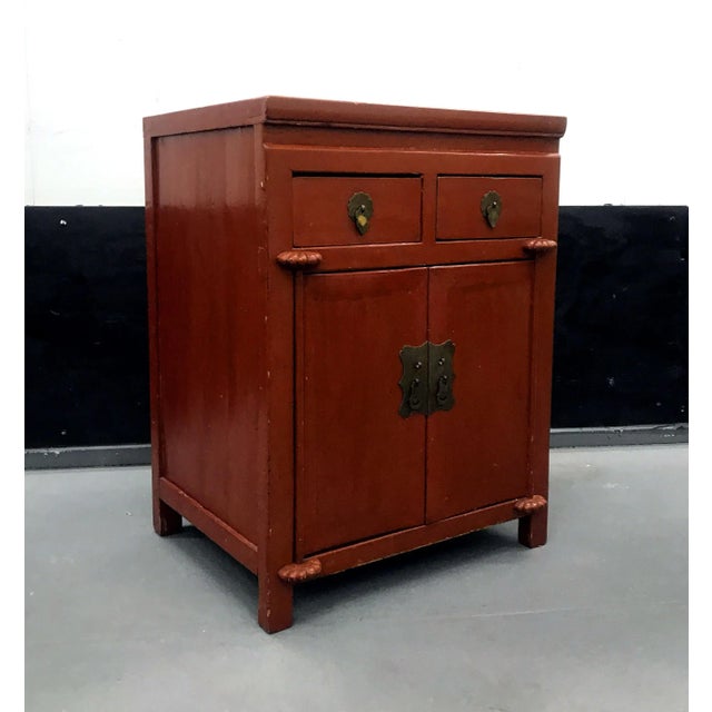 A small antique Chinese Northern country-style bedside cabinet or nightstand with two drawers and two detachable door...