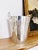 A wonderful vintage circa 1950s English silver plated ice bucket with its original strainer, by Asprey & Co. In excellent...