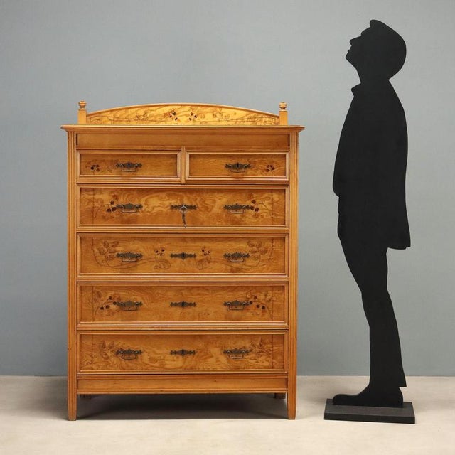 Liberty chest of drawers in ash and maple, attributed to Ernesto Basile, crafted by the Grandiosi Magazzini Emporio Roma...