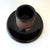 A classic antique English match striker in black glazed stoneware, featuring a ribbed cylindrical striking surface and...