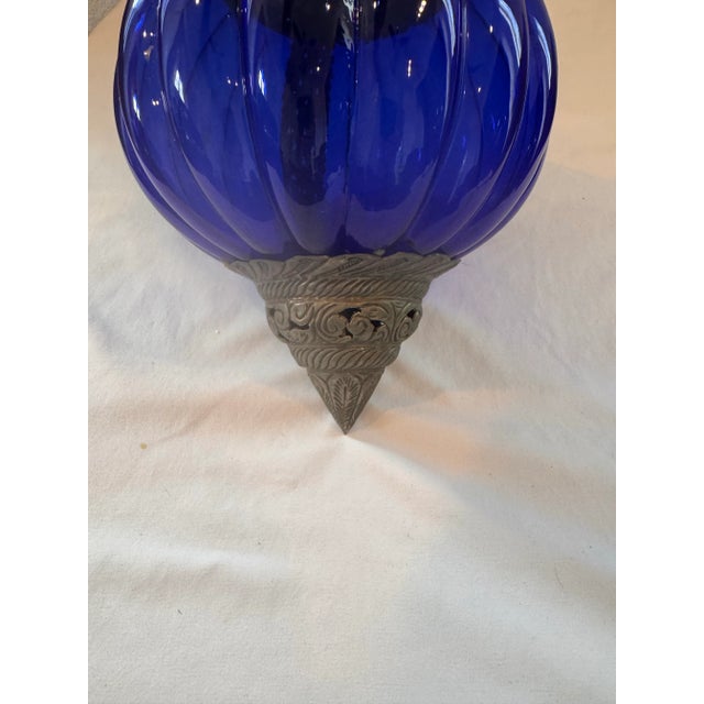 A stunning vintage decorative hanging piece that exudes global elegance and artisan craftsmanship. This large cobalt blue...