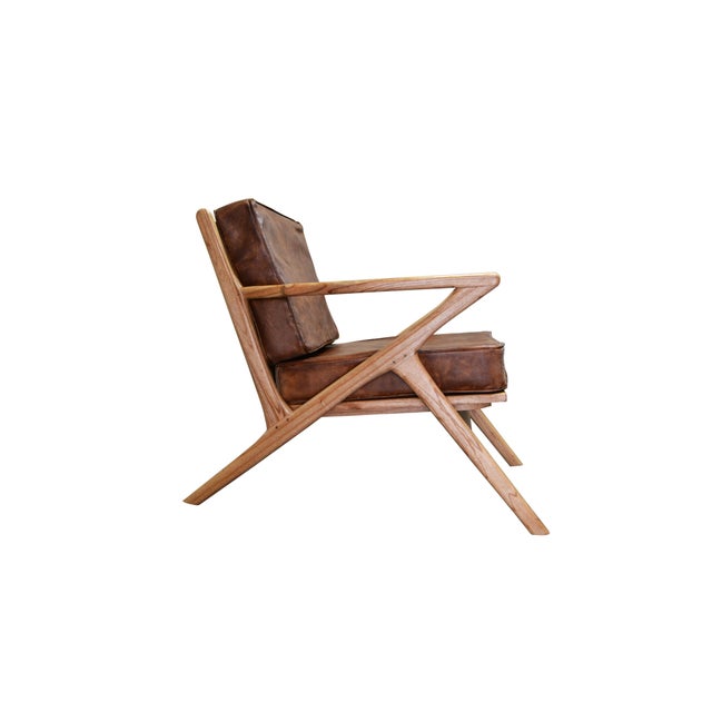 About New bentwood armchair with wood seat and back and brown skin cushions Ideal for hospitality Measures: Arm height...
