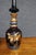 Striking pair of royal purple art glass decanters featuring elaborate gilt horse decoration with botanical and geometric...