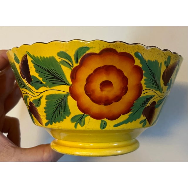 Antique early 19th century English Staffordshire canary yellow bowl with ruffled rim. Decorated with hand painted garland...