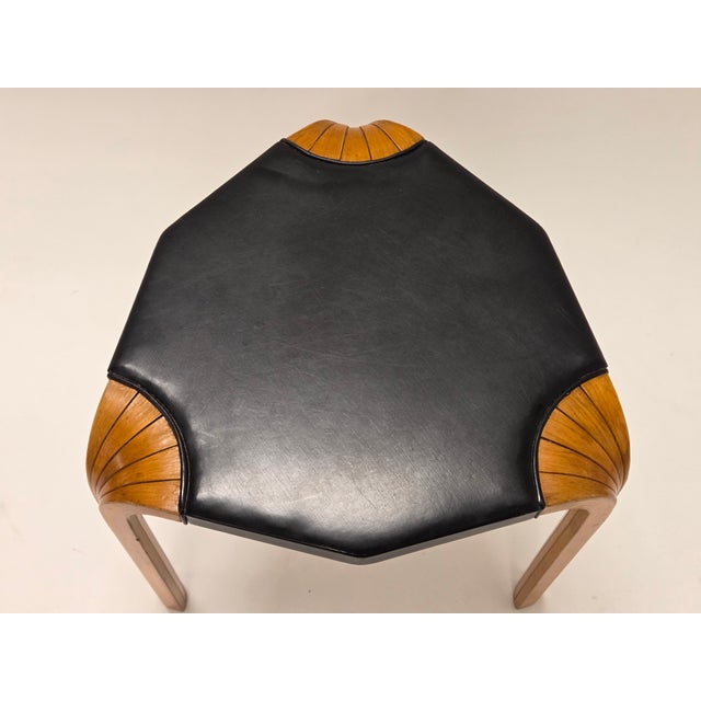 Artek X602 stool, design by Alvar Aalto. Birch with black faux leather upholstery, beautiful fan legs, and wonderful...