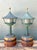 Capture the essence of mid-century coastal charm with this exceptional pair of patinated lighthouse lamps. Artfully...