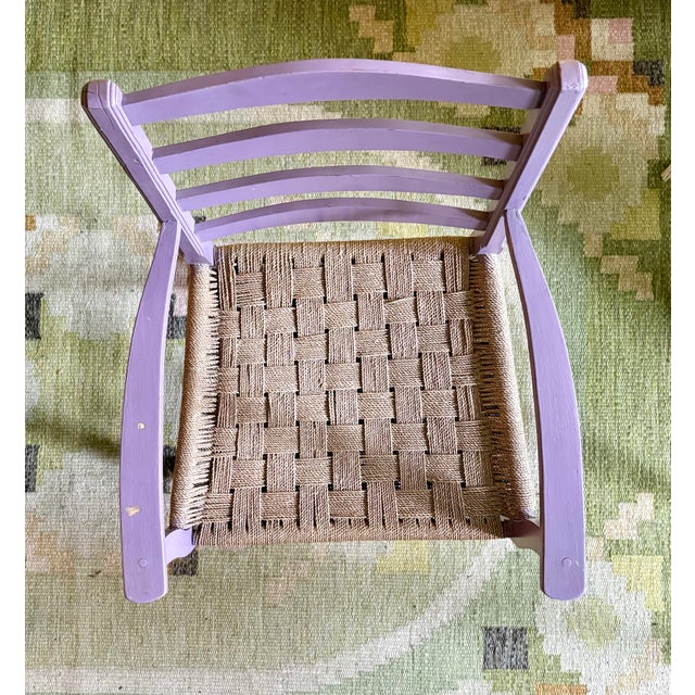 vintage Danish Modern style ladder-back armchair featuring a hand-woven envelope-pattern seat. While traditionally crafted...