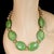 A striking 20‑inch lime green magnesite tablet necklace that instantly brightens any outfit. Each large, smooth magnesite...