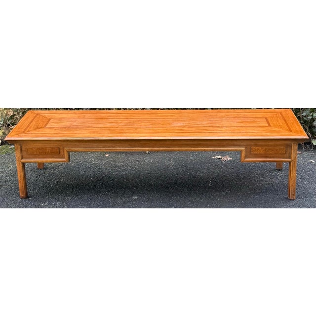 Sleek mid century coffee table with banded inlay top. Square feet, raised panel detailing on the apron. Solid wood...