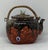 Sumida Gawa teapot. Vintage Japanese drip glaze over red ground. Figures on one side. Bird finial. Sumida Gawa art pottery...