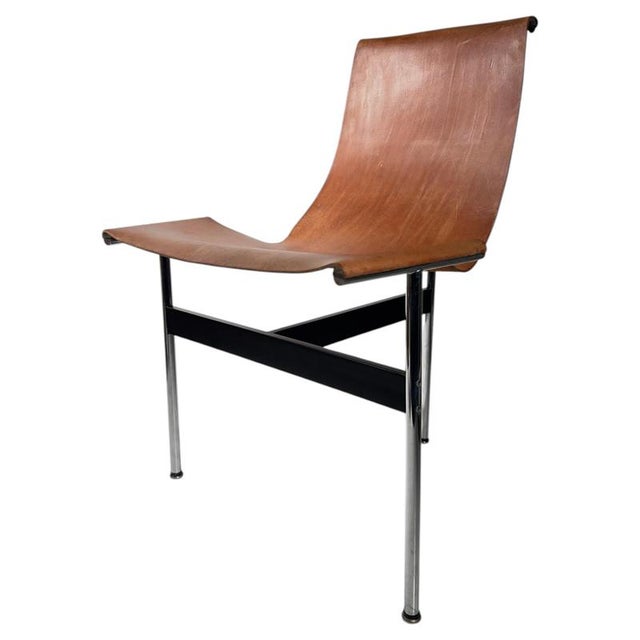 Architectural purity meets warm, organic comfort. This set of six original 'Model 3LC' T-Chairs stands as one of the most...