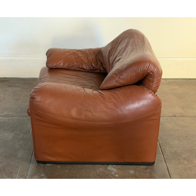 1970's Cognac leather lounge chair by Cassina in good vintage condition. Patina all around the leather, please check all...