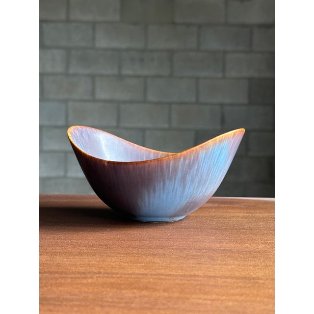An ceramic bowl designed by Gunnar Nylund for Rörstrand circa 1950s. Gorgeous glaze and great movement with the bowl, this...