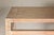 A tall wooden console table with carved beaded rope molding, whitewash natural finish, straight legs and open apron. This...