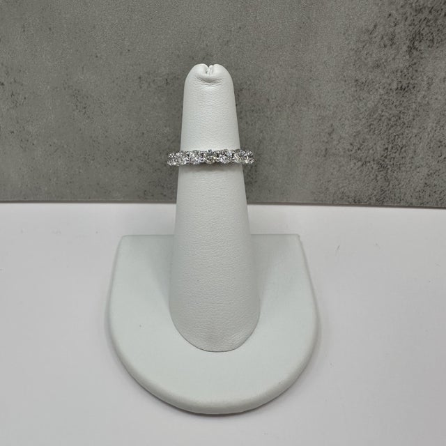 This elegant lab grown diamond eternity style ring is crafted in 14K white gold and features 1.79 carats total weight of...