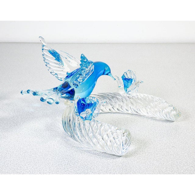 Murano blown glass sculpture depicting a bird in flight with flowers. Origin murano period 1960s materials transparent...