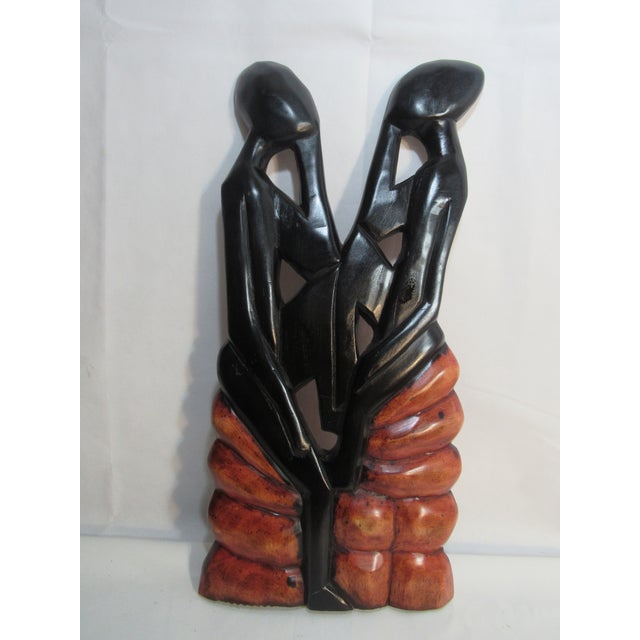 This is so charming, Rustic look on back with leather loop for hanging, shiny and polished on front. Elegant figures...