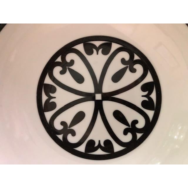 Retired Limoges porcelain bowl, circa early 2000s, from Vellum in the "Rialto" pattern. Beautiful black and white fleur-...