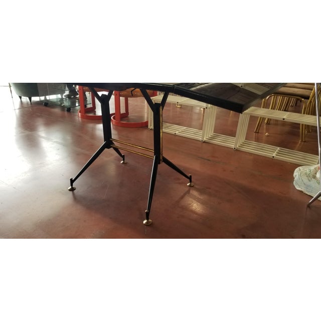 Vintage Extendable Dining Table Black Dining Table Dim: 63.5"W x 31.5"D x 31"H, closed: 43"W Origin: Italy Material: Black...