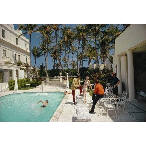 Posing by the Pool 1968 A swimming pool in Palm Beach, Florida, 1968. (Photo by Slim Aarons) Slim Aarons was one of the...