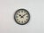 This wall clock was produced by Siemens in Germany during the 1950s. It features a grey iron frame, a metal dial and a...