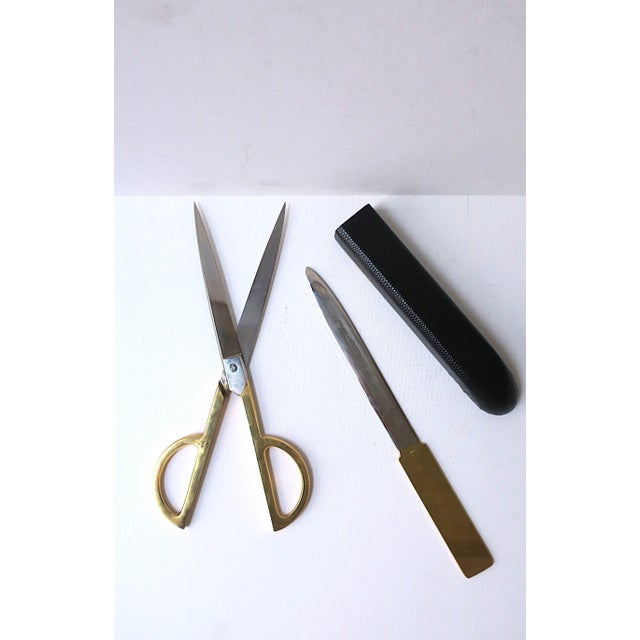 A beautiful set of fine Italian brass-plated and stainless-steel scissors, letter opener, and grained leather case, Post-...