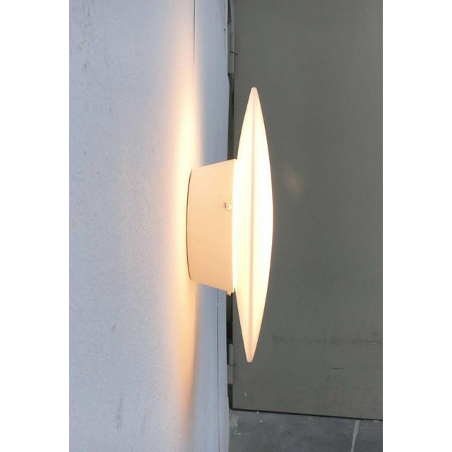 Eklipta wall/ceiling lamp by louis poulsen, designed by arne jacobsen. a simple design classic by poulsen. The shape of...
